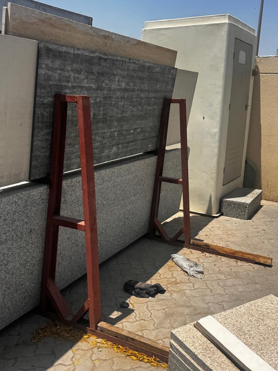 Red A-frame carrying marble slabs