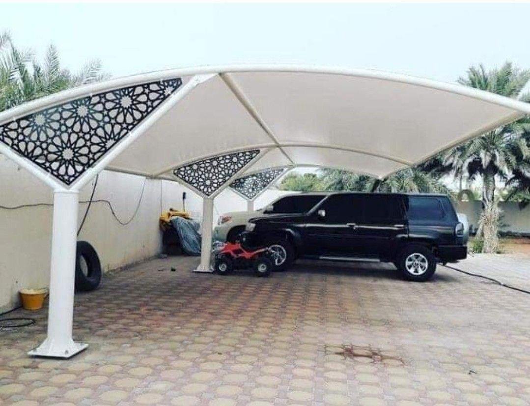 Completed arched parking shade with laser-cut panels